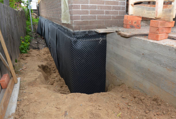 Happy homeowners after waterproofing job in Francis Creek